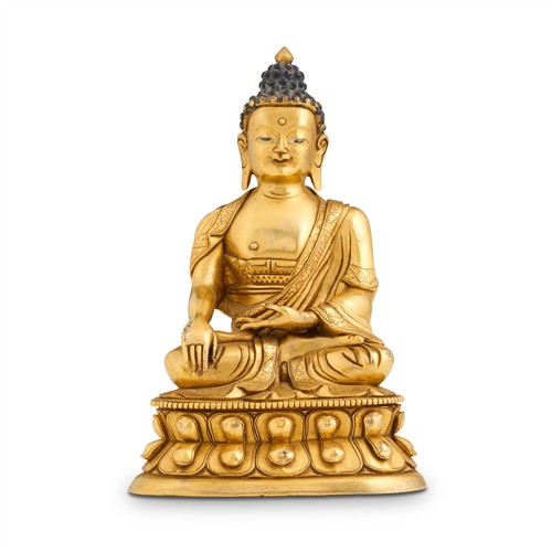 75 · A SINO-TIBETAN GILT BRONZE SEATED FIGURE OF BUDDHA, 18TH CENTURY