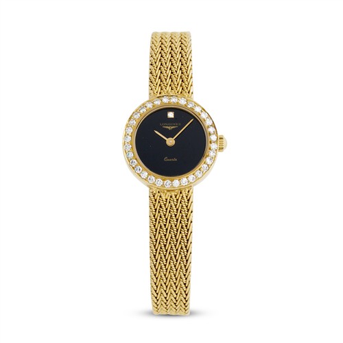 35 · LONGINES A LADY'S 18CT GOLD AND DIAMOND-SET BRACELET WATCH CIRCA 1980