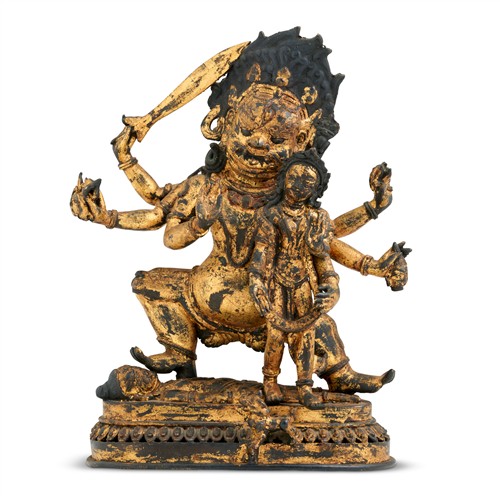 81 · A TIBETAN GILT-LACQUER BRONZE STANDING FIGURE OF MAHAKALA, 17TH CENTURY