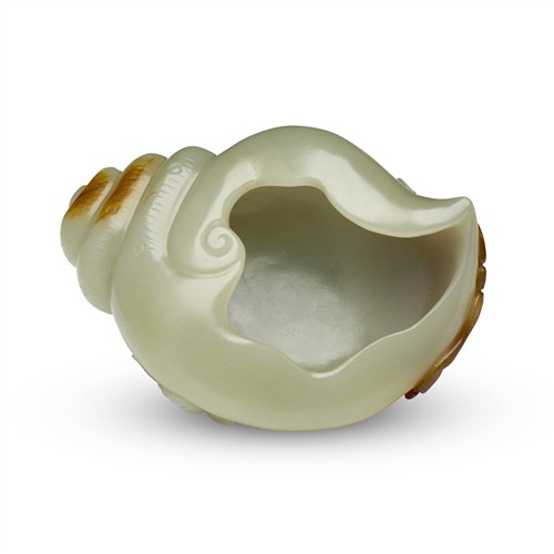 78 · A CHINESE CELADON JADE CARVED CONCH-FORM WASHER, QING DYNASTY (1644 - 1911)