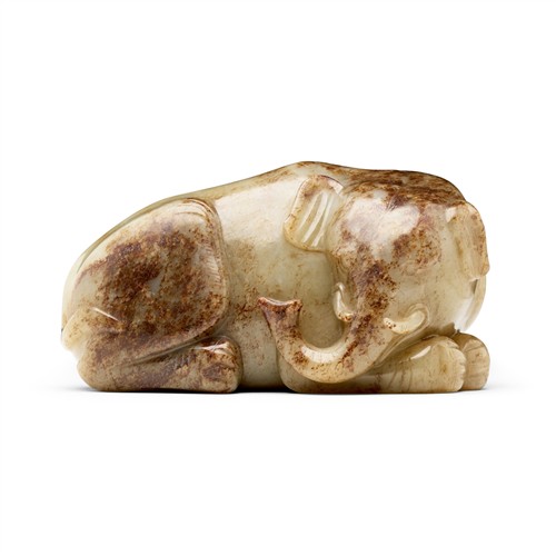 55 · A CHINESE YELLOWISH - WHITE AND RUSSET JADE ELEPHANT, MING DYNASTY (1644 - 1911)