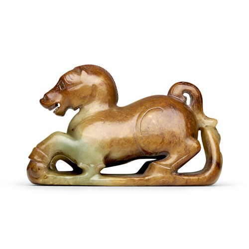 1063 · A CHINESE YELLOW AND RUSSET JADE HORSE