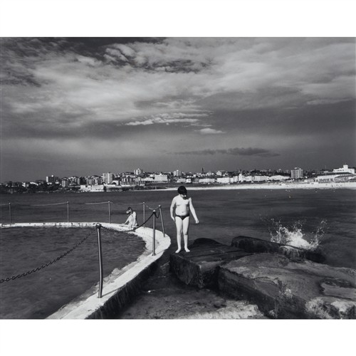 JON LEWIS (1950-2020) Standing on the Rock at Bondi black and white photograph 36 x 45cm (58 x 66cm framed)