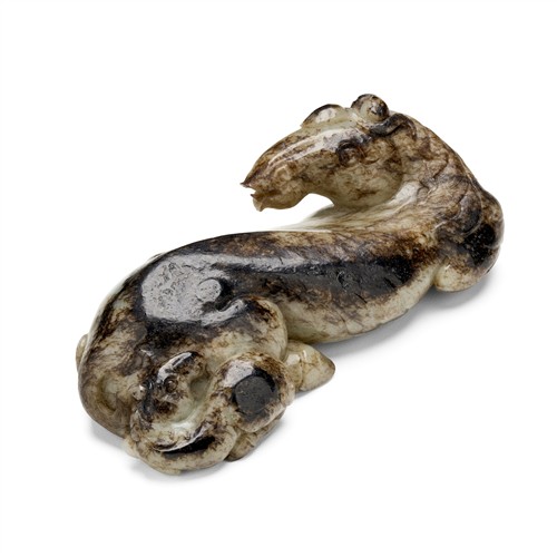 58 · A CHINESE PALE WHITE AND DARK JADE CARVING OF TWO HORSES, MING DYNASTY (1368 - 1644)