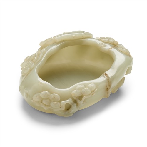 A CHINESE CELADON WHITE JADE CARVED WASHER, QING DYNASTY (1644 - 1911)