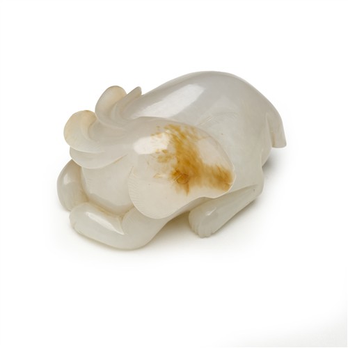 56 · A CHINESE WHITE JADE CARVING OF A RABBIT, QING DYNASTY (1644 - 1911)