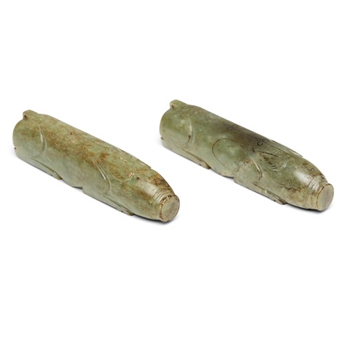 1061 · A PAIR OF CHINESE CELADON JADE CARVED PIGS, POSSIBLY HAN DYNASTY (206 BCE - 220 CE)