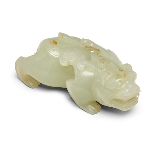 59 · A CHINESE WHITE CARVED MYTHICAL BEAST, QING DYNASTY (1644 - 1911)