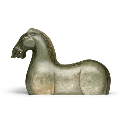 1066 · A CHINESE CELADON JADE CARVED HORSE, POSSIBLY HAN DYNASTY