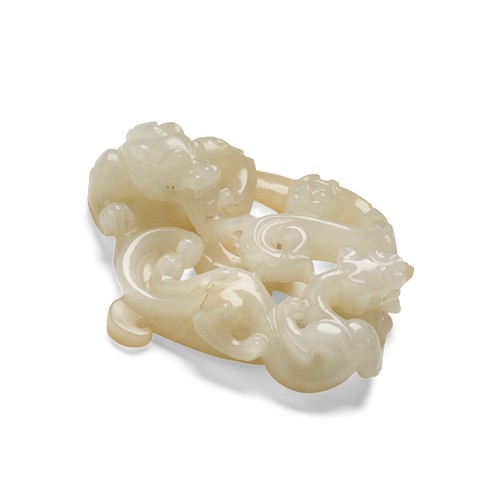 67 · A CHINESE WHITE JADE CARVED 'DRAGON' PENDANT, QING DYNASTY (1644 - 1911)
