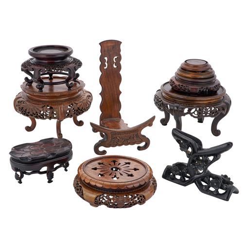 78 · A COLLECTION OF TEN CHINESE CARVED HARDWOOD PLATE, BOWL, AND VASE STANDS