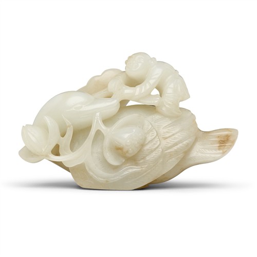 62 · A CHINESE WHITE JADE CARVING OF A BOY RIDING A BIRD, QING DYNASTY (1644 - 1911)