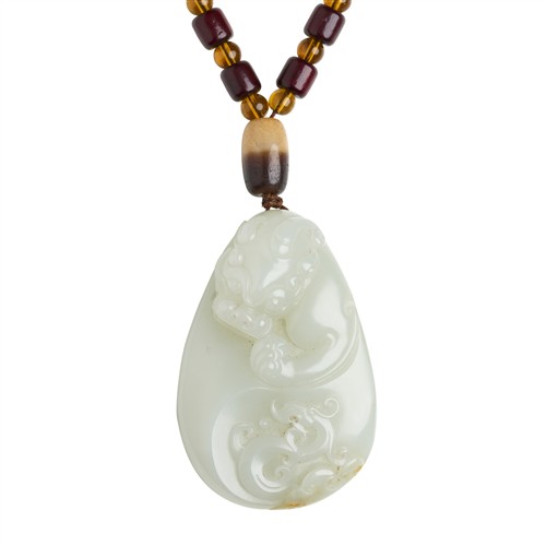 A CHINESE WHITE JADE CARVED DRAGON PENDANT, 20TH CENTURY