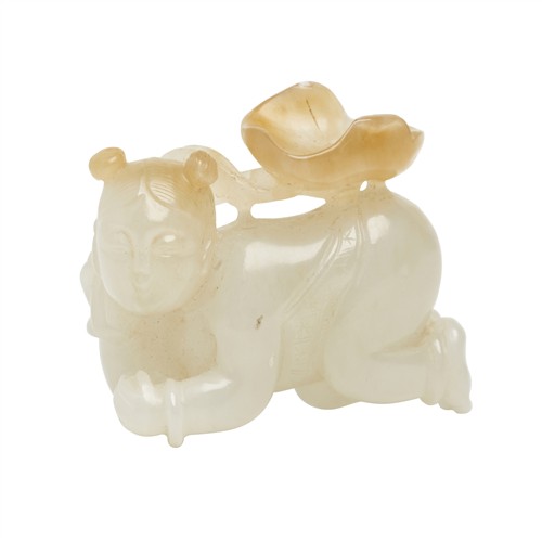 32 · A CHINESE WHITE JADE CARVED BOY HOLDING A LOTUS LEAF, QING DYNASTY (1644 - 1911)