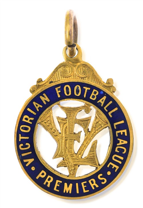 1055 · A 1940 MELBOURNE PREMIERSHIP MEDAL AWARDED TO RON BARASSI SNR