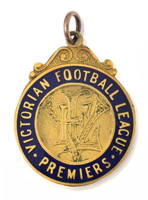 1056 · AN IMPORTANT POSTHUMOUS 1941 MELBOURNE PREMIERSHIP MEDAL AWARDED TO RON BARASSI SNR