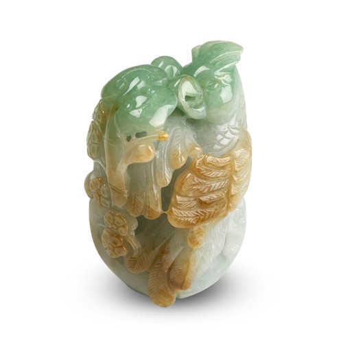 31 · A CHINESE CARVED JADEITE CARVED PARROT