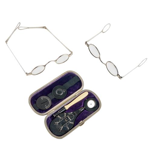 71 · A CASED OPTHALMOSCOPE BY LANDOLT TOGETHER WITH TWO PAIRS OF SILVER FOLDING SPECTACLES