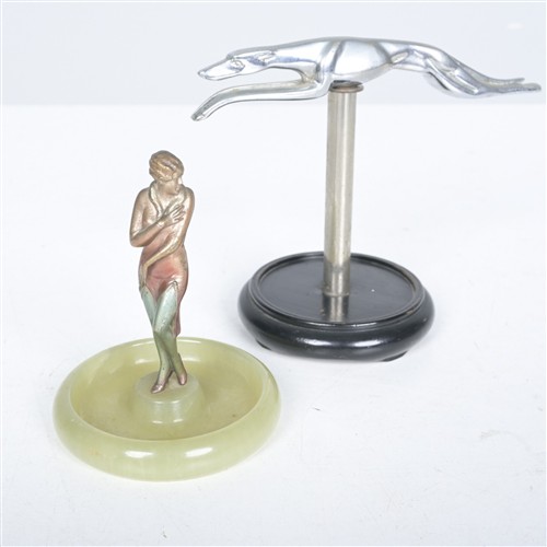 AN ART DECO COLD PAINTED BRONZE FIGURE OF A WOMAN ON AN ONYX BASE, ATTRIBUTED TO LORENZL, TOGETHER WITH A CHROME GREYHOUND ON PEDEST...