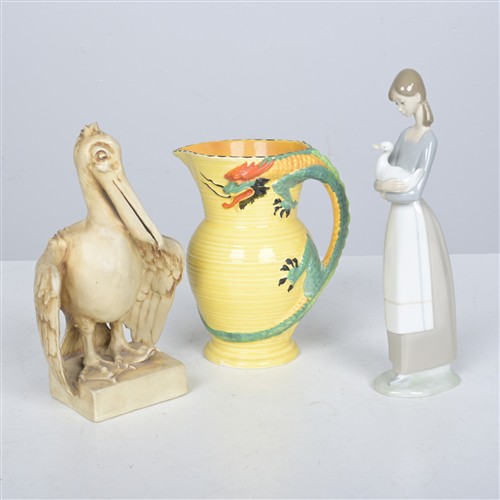 THREE CERAMIC ITEMS INCLUDING A JUG BY BURLEIGH, ENGLAND, A CERAMIC PELICAN, AND SPANISH CERAMIC FIGURINE (26H CM)