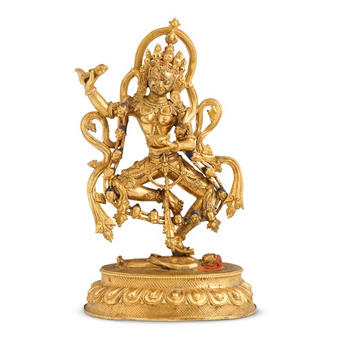 83 · A TIBETAN GILT-BRONZE STANDING FIGURE OF VAJRA DAKINI, 18TH/19TH CENTURY