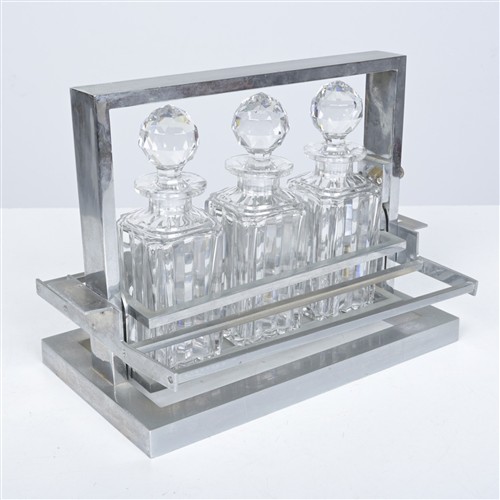 AN ART DECO CHROME FRAMED TANTALUS (27H X 37W X 24D CM)
