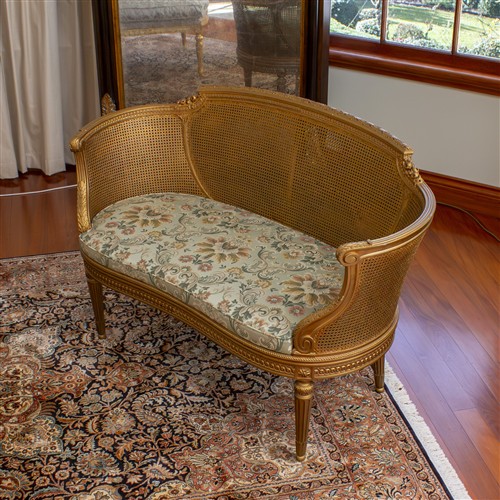 2 · LOUIS XVI STYLE GILTWOOD AND CANED SETTEE