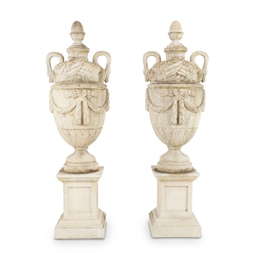 25 · A PAIR OF LARGE COMPOSITE STONE GARDEN URNS IN NEO-CLASSICAL STYLE, ON PEDESTALS Late 20th century