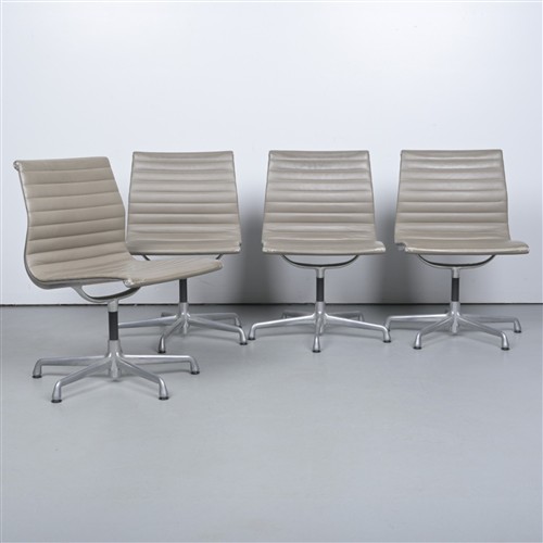62 · A SET OF FOUR CHARLES AND RAY EAMES DESK CHAIRS (84H X 51W X 58D CM)