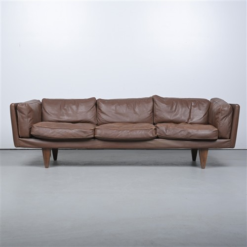 64 · AN ILLUM WIKKELSO LEATHER UPHOLSTERED V11 SOFA (70H X 230W X 83D CM)