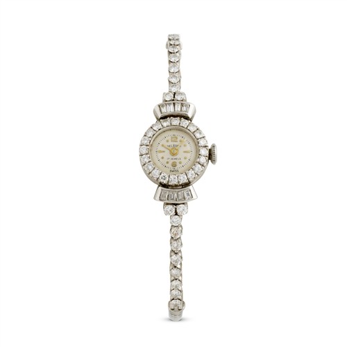 38A · DELBANA A LADY'S PLATINUM AND DIAMOND-SET COCKTAIL WATCH RETAILED BY KOZMINSKY GALLERIES CIRCA 1950