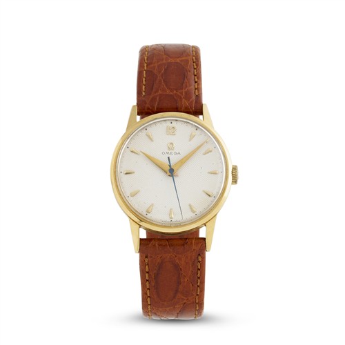 56 · OMEGA AN 18CT GOLD WRIST WATCH CIRCA 1952