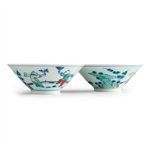 11 · A RARE AND FINE PAIR OF CHINESE DOUCAI "BOYS" CONICAL BOWLS, CHENGHUA MARK, KANGXI/YONGZHENG PERIOD, 17TH/18TH CENTURY