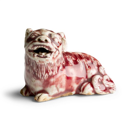 20 · A FINE CHINESE UNDERGLAZE COPPER RED LION, QING DYNASTY, 17TH CENTURY