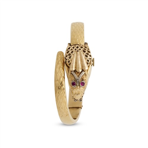 36A · DOXA A LADY'S 18CT GOLD CONCEALED DIAL SERPENT FORM BANGLE WATCH CIRCA 1955