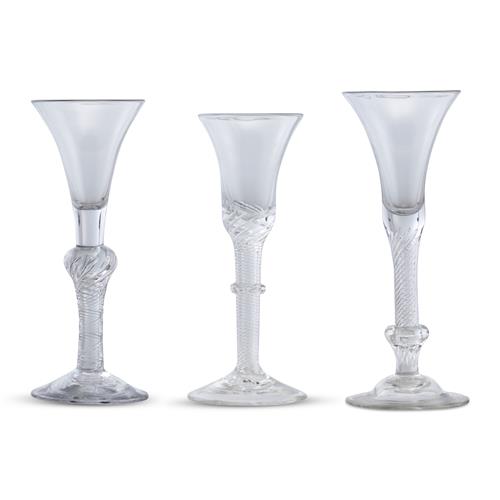 10 · THREE GEORGE II AIR TWIST STEMMED WINE GLASSES Mid-18th century, circa 1750