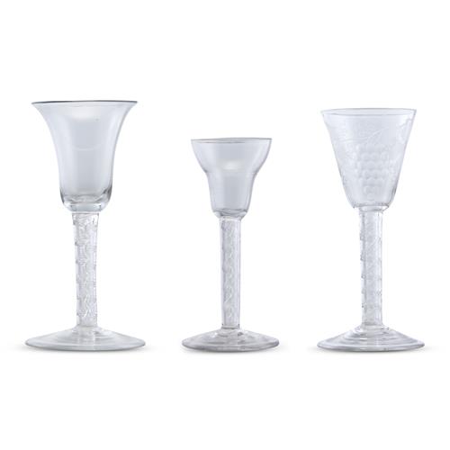 11 · THREE MID-GEORGIAN AIR TWIST STEMMED WINE GLASSES Mid-18th century, circa 1750-60
