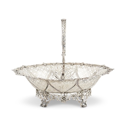 70 · AN EARLY GEORGE III STERLING SILVER SWING-HANDLED CAKE BASKET Maker's mark 'W[..?], possibly William Plummer, London, probably 1765..