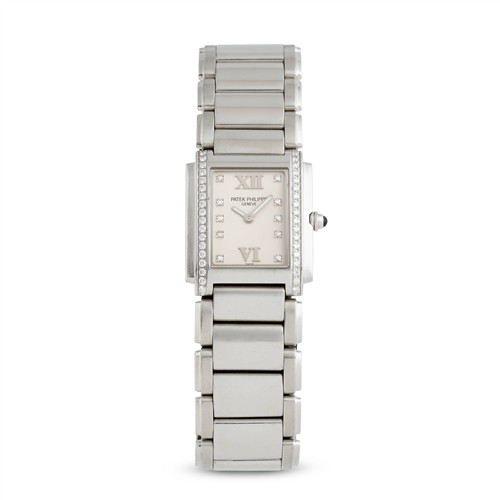 PATEK PHILIPPE TWENTY-24 REF 4910/010 A LADY'S STAINLESS STEEL AND DIAMOND-SET BRACELET WATCH CIRCA 2000