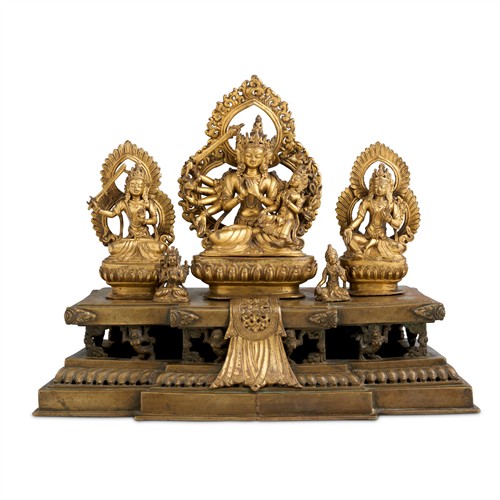 91 · A LARGE AND RARE NEPALESE GILT-BRONZE BUDDHIST TRINITY GROUP, DATED TO 1832 AND OF THE PERIOD