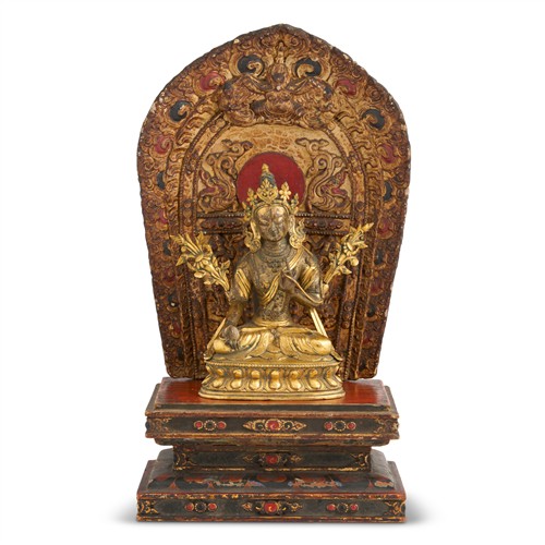 86 · A SINO-TIBETAN GILT BRONZE SEATED FIGURE OF WHITE TARA, QIANLONG PERIOD, 18TH CENTURY