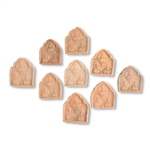 1093 · A GROUP OF 9 POTTERY MOULDED BUDDHIST PLAQUERS, TANG DYNASTY (618 - 907)
