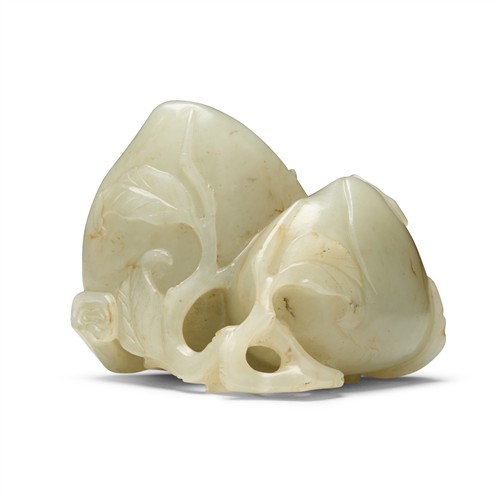 82 · A CHINESE CELADON JADE CARVED DOUBLE PEACHES, QING DYNASTY (1644 - 1911)
