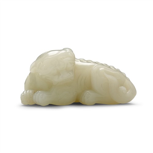 72 · A FINE CHINESE WHITE CARVING OF A LION, MID-QING DYNASTY, 18TH CENTURY