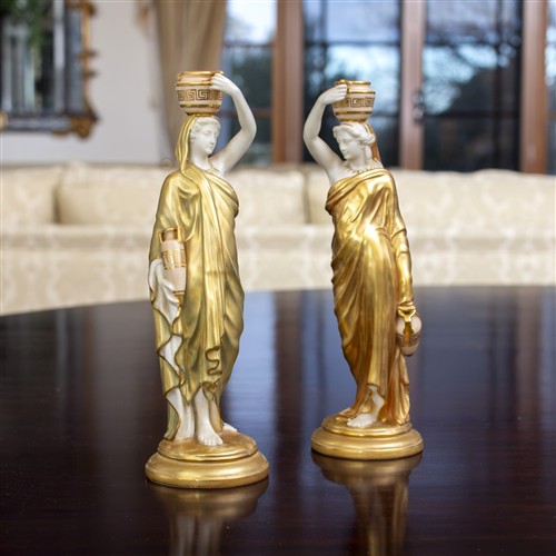 A PAIR OF ROYAL WORCESTER GRECIAN FIGURES WITH URNS