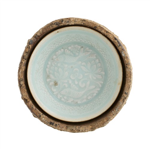 65 · A CHINESE MOULDED QINGBAI DISH WITH ITS SAGGAR, SOUTHERN SONG DYNASTY (1127 - 1279)