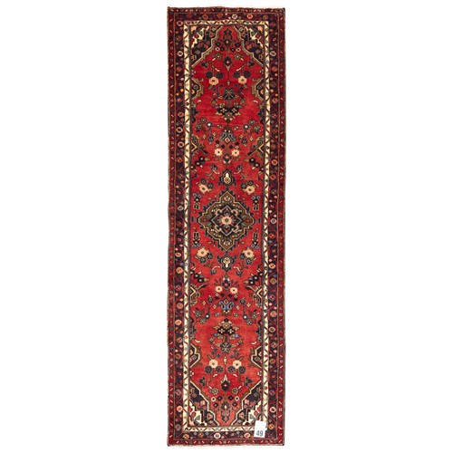 49 · A PERSIAN MEHRABAN RUNNER (295L X 80W CM)