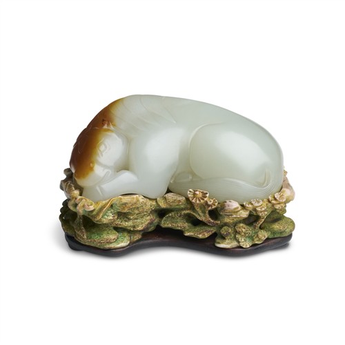 85 · A FINE CHINESE WHITE AND RUSSET JADE HORSE, QING DYNASTY (1644 - 1911)