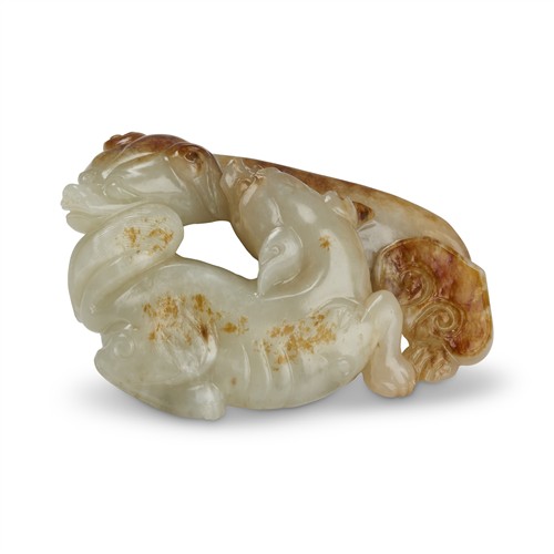 A Chinese White And Russet Jade Carving Of Two Dogs, Qing Dynasty (1644 - 1911)