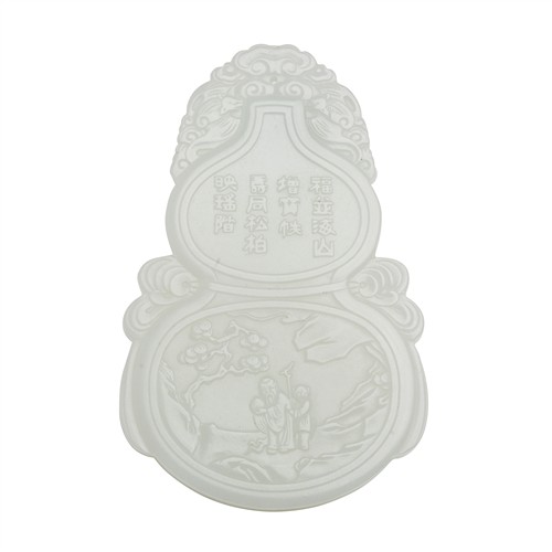 23 · A CHINESE WHITE JADE DOUBLE GOURD FORMED PENDANT, QING DYNASTY (1644 - 1911)
